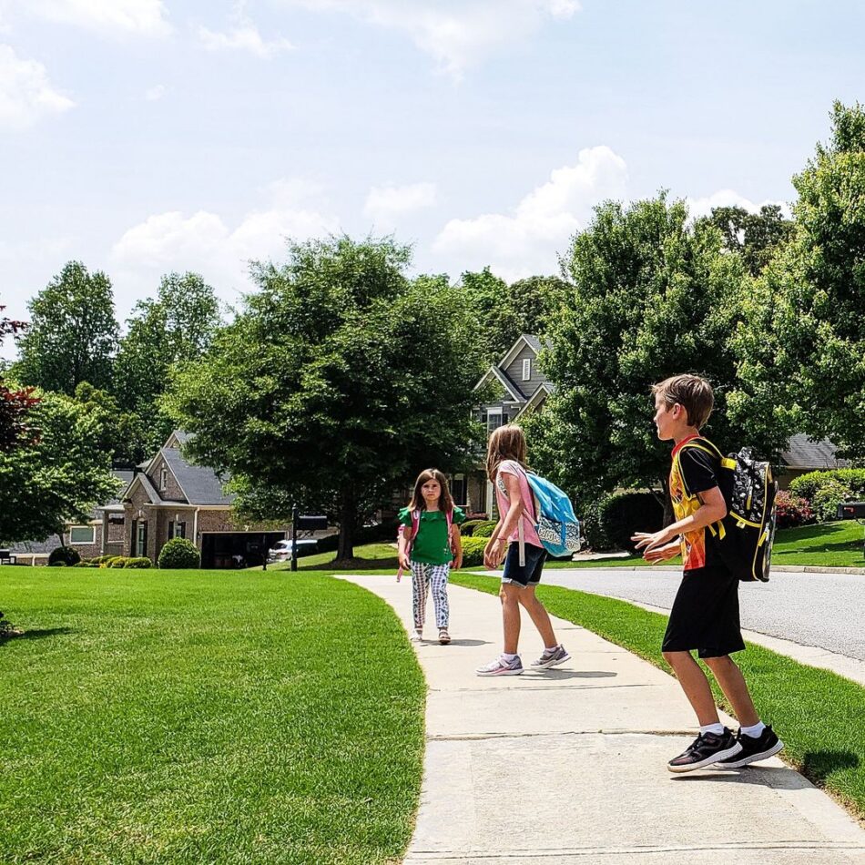 Kids Walking On Uneven Sidewalk